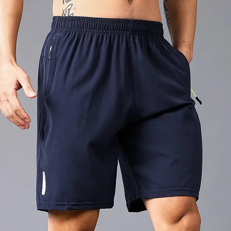 Men's navy quick-dry jogging shorts with elastic waistband and neon zip pockets, lightweight