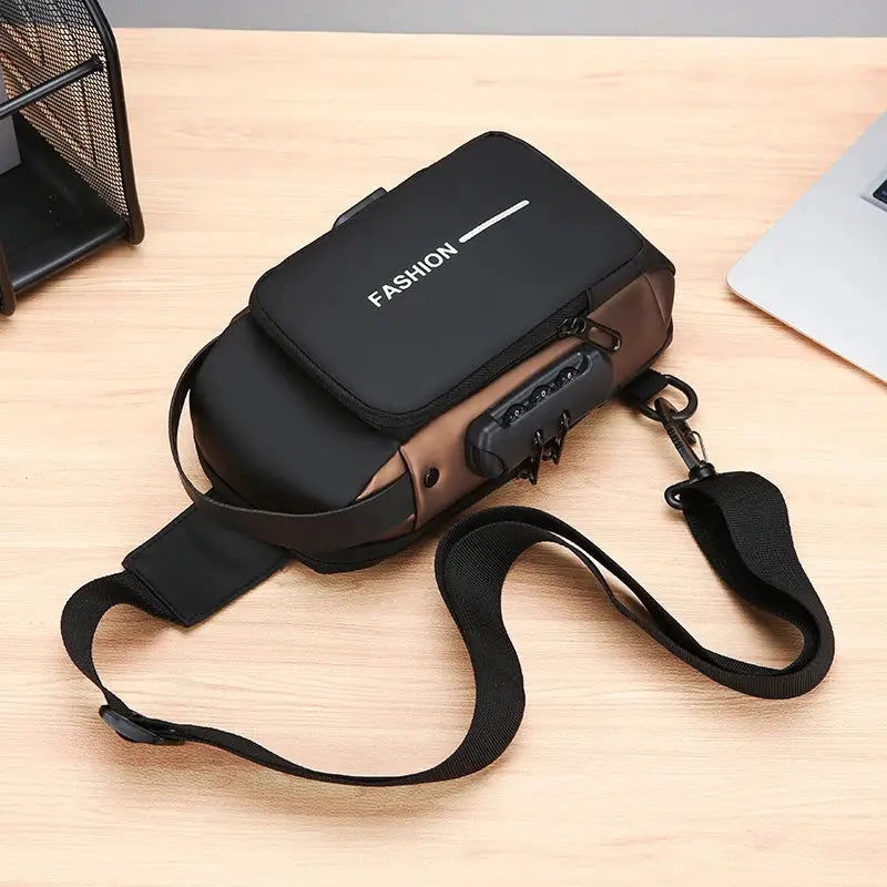Men's anti-theft chest bag crossbody with black top flap labeled FASHION and brown side panels, adjustable strap