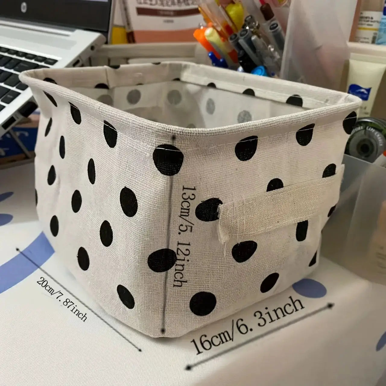 Small foldable canvas storage basket with handle, white with black polka dots