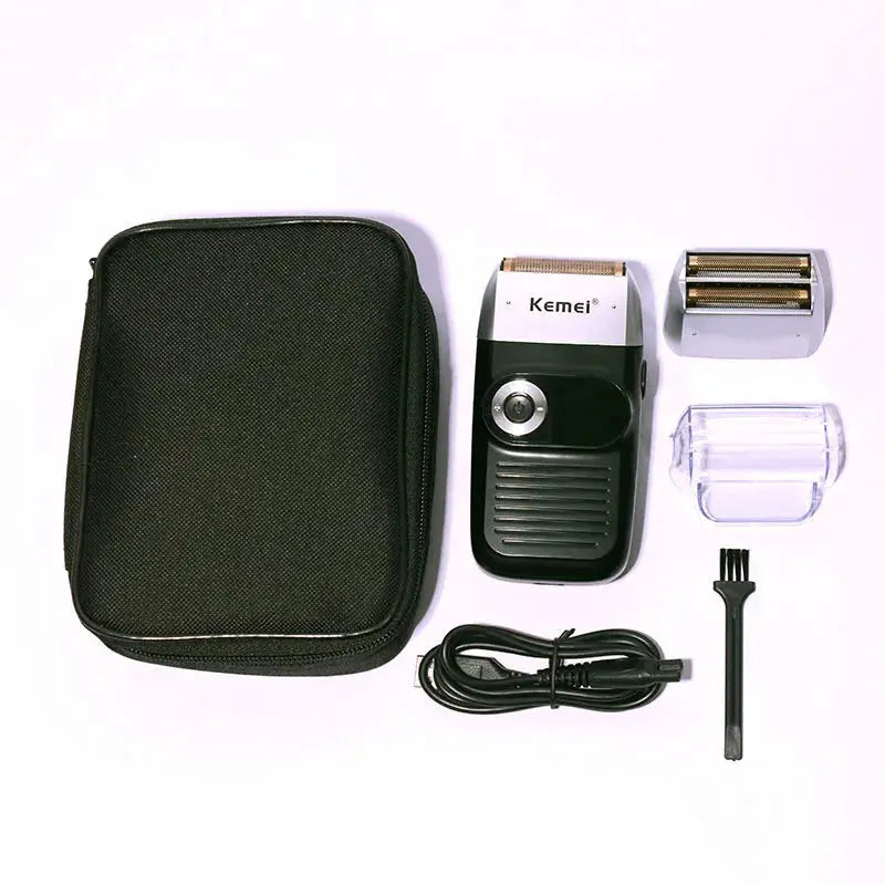 Kemei electric shaver set with black body, includes carry case, USB charger, cleaning brush, and extra foil head attachments