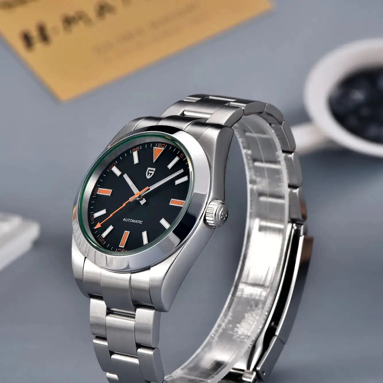 PAGANI DESIGN men's stainless steel automatic wristwatch with black dial, orange accents, and green bezel.