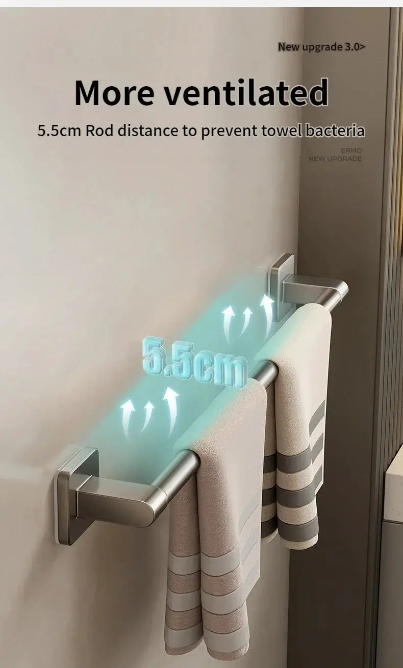 Towel rack with no-drill wall mounting, stainless steel; dual bars holding two beige striped towels.