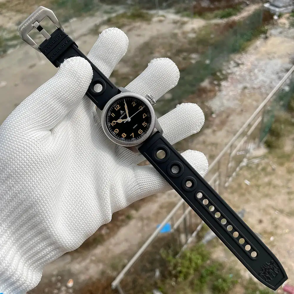Steelflier SF741 wristwatch with black silicone strap and round holes, silver bezel, black dial with beige numerals