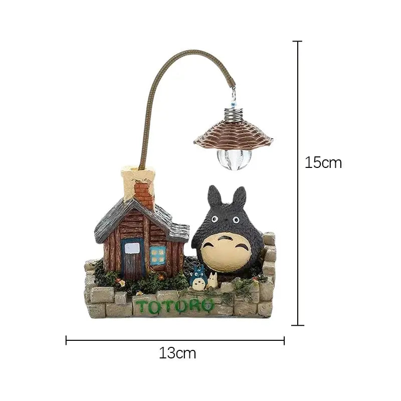 Totoro LED desk lamp by Simples Market; anime figure with hanging bulb on curved arch, stone base