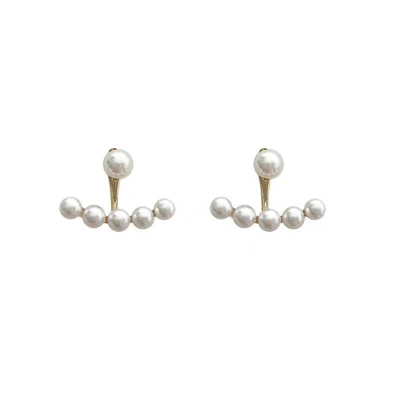 Simples Market imitation pearl earrings, white pearls on gold-tone curved bars, pair