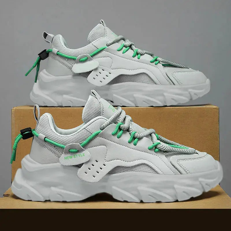 Men's sneakers with breathable gray mesh, thick white sole and green laces (pair shown)