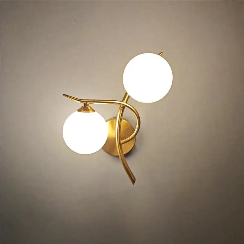 Nordic modern iron wall lamp with dual glass globes in brass finish