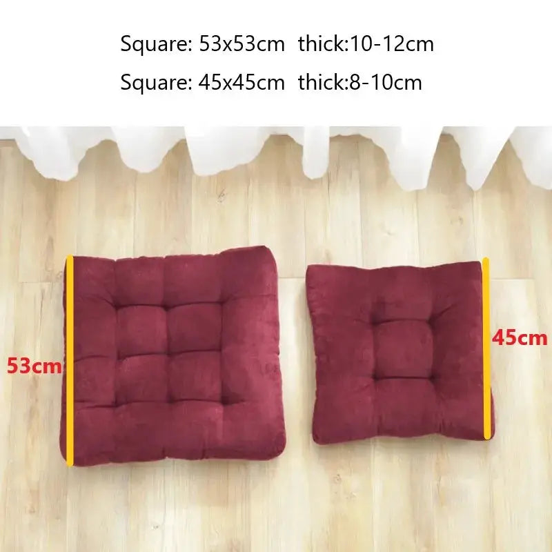 Floor pillows: two burgundy tufted square cushions, 53x53 cm and 45x45 cm.