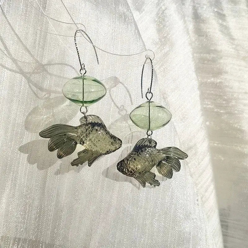 Creative goldfish earring pair with translucent green bead pendant