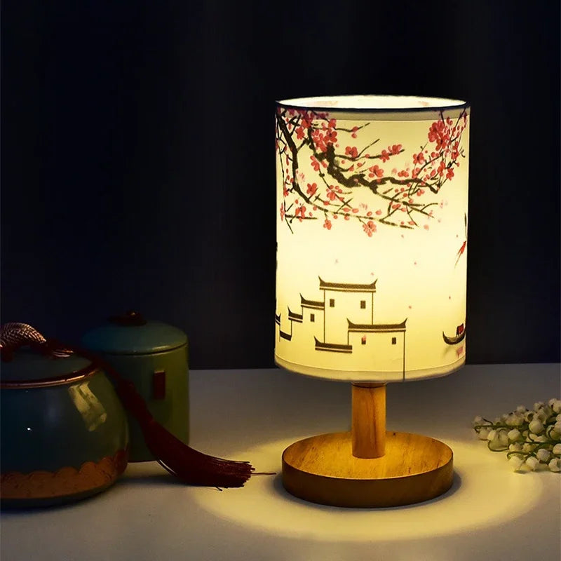 LED table lamp with fabric shade featuring plum blossom in Chinese style; dimmable warm light, wooden base