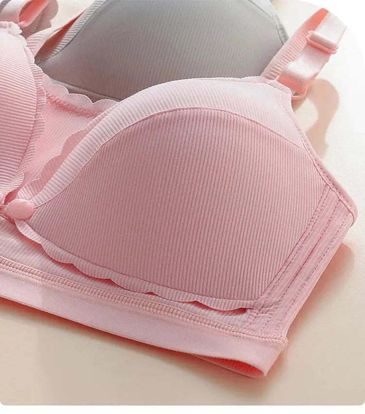 Pink women's push-up bra with ribbed cups and adjustable straps