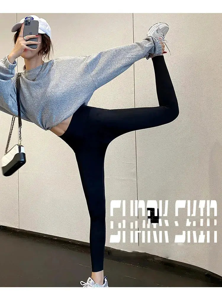 Women's black high-waist athletic leggings with a slim, tight fit and elastic waistband