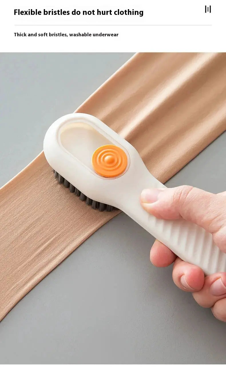 Automatic liquid-discharge shoe cleaning brush with soft bristles, white handle and orange button