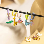 Cartoon animal pendant hoop earrings, six colorful pastel charms featuring giraffe, fish, and dinosaur
