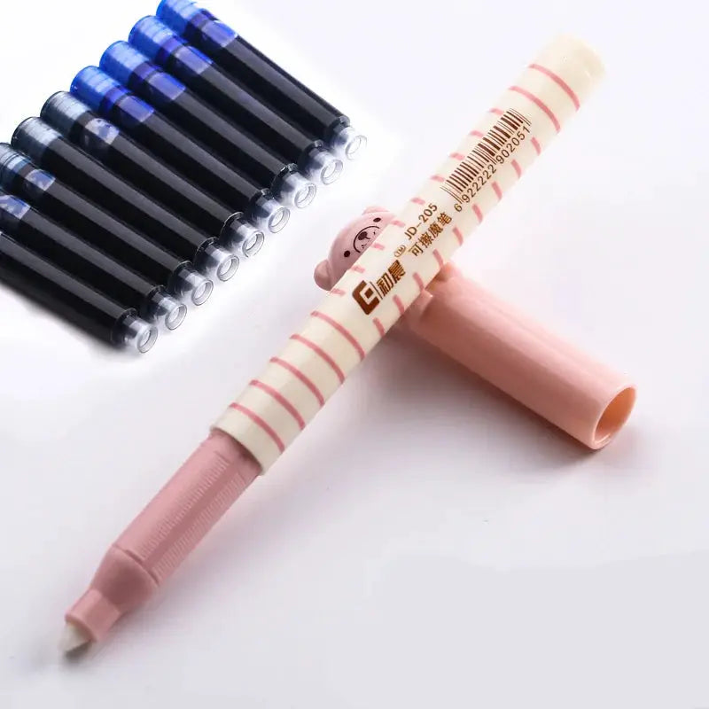 Fountain pen set with pink striped pen and several black and blue pens