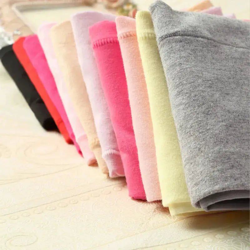 4-piece cotton high-waist panties for women in a pastel color assortment, neatly folded and displayed