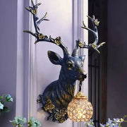Lucky Deer wall lamp with blue resin deer and gold flower accents, crystal globe light