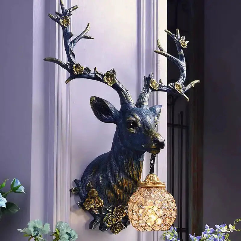 Lucky Deer wall lamp with blue resin deer and gold flower accents, crystal globe light