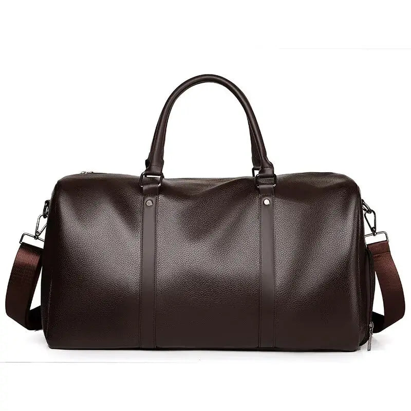 Duffel bag in brown PU leather with dual top handles and removable shoulder strap; large capacity travel/sports bag