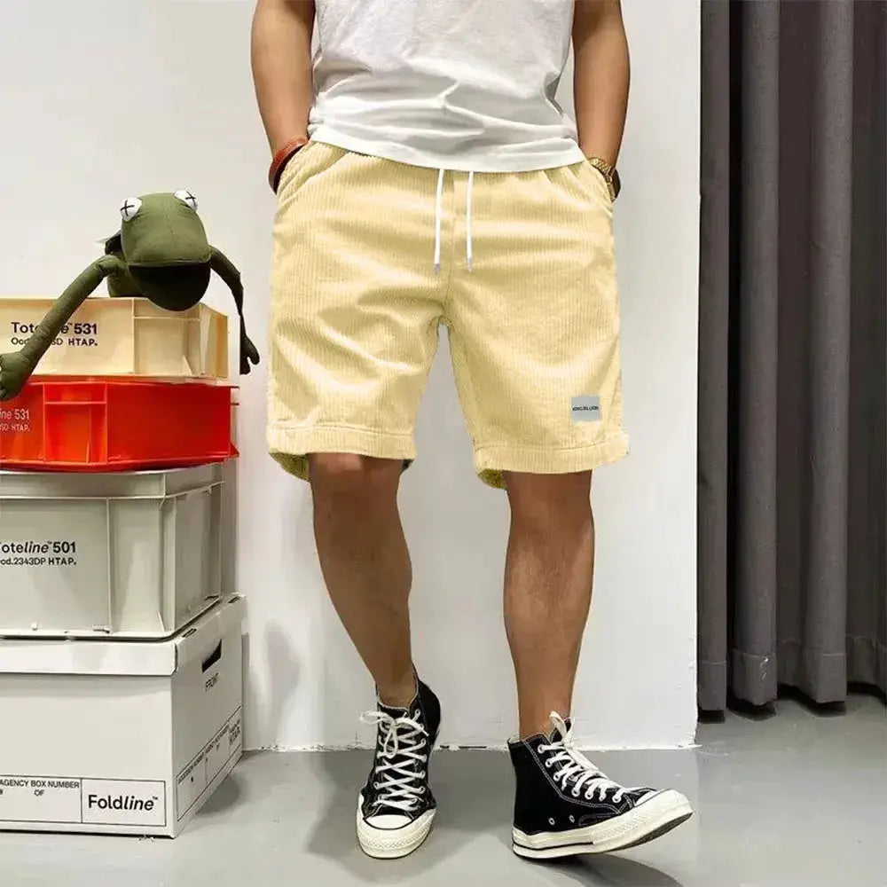 Men's light yellow corduroy shorts with elastic waist and white drawstring, Simples Market baggy shorts
