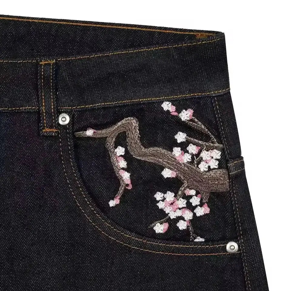 Denim jeans with cherry blossom embroidery on the pocket, dark indigo, wide-leg.