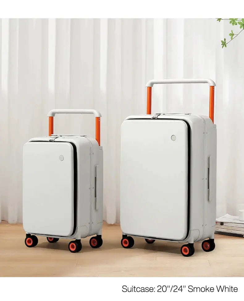 Two carry-on suitcases, smoke-white aluminum-frame set with orange extendable handles, 20- and 24-inch sizes.