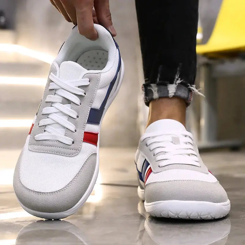 Wide anti-slip running shoes by Simples Market, lightweight breathable white sneakers with blue and red side accents