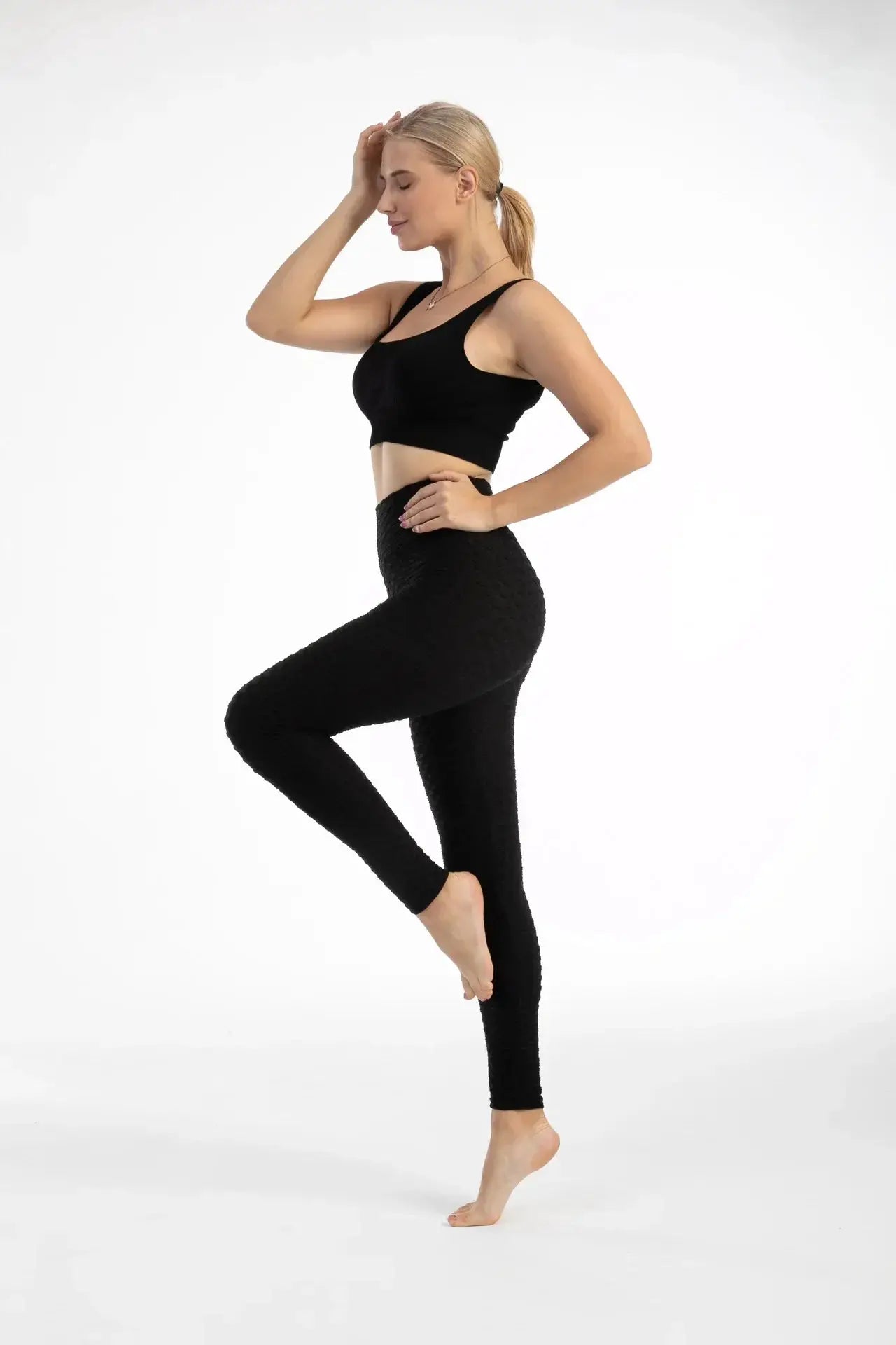 Women's high-waisted seamless bubble leggings in black for yoga workouts