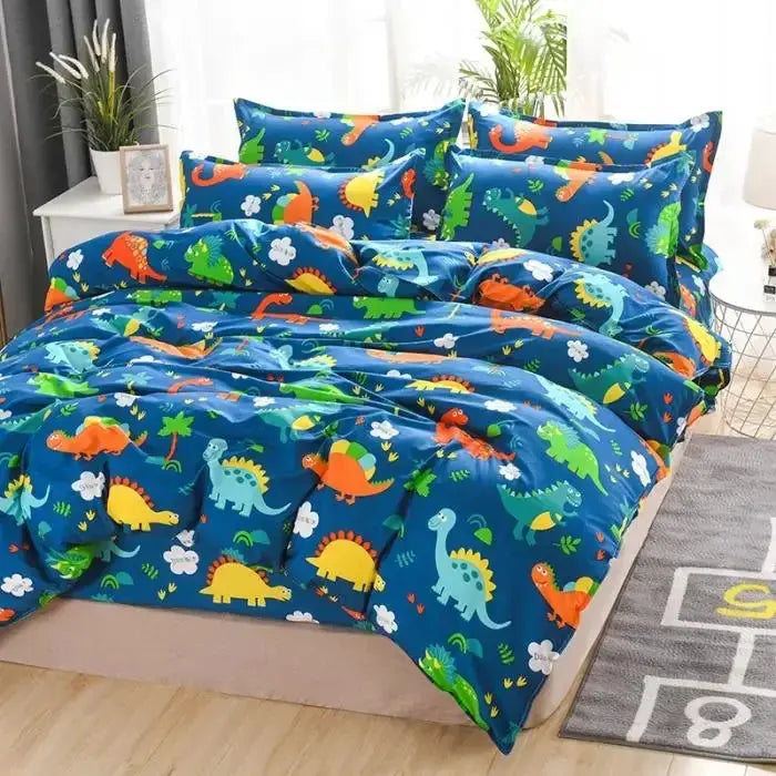 Blue dinosaur-print cotton bedding four-piece set on bed, including sheets, quilt cover and pillowcases.