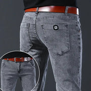 Men's gray denim jeans with slim straight leg, mid-rise, R-logo patch on back pocket