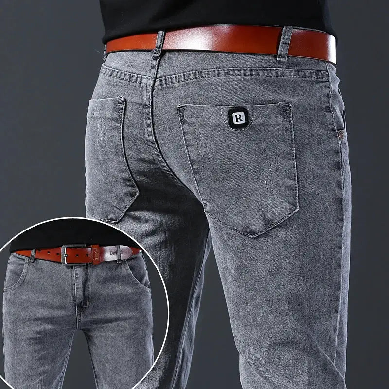 Men's gray denim jeans with slim straight leg, mid-rise, R-logo patch on back pocket
