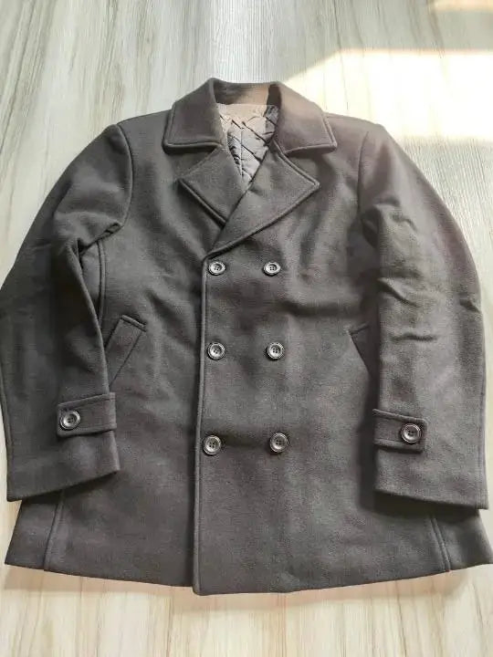 Men's double-breasted wool coat in dark gray with quilted lining and buttoned cuffs