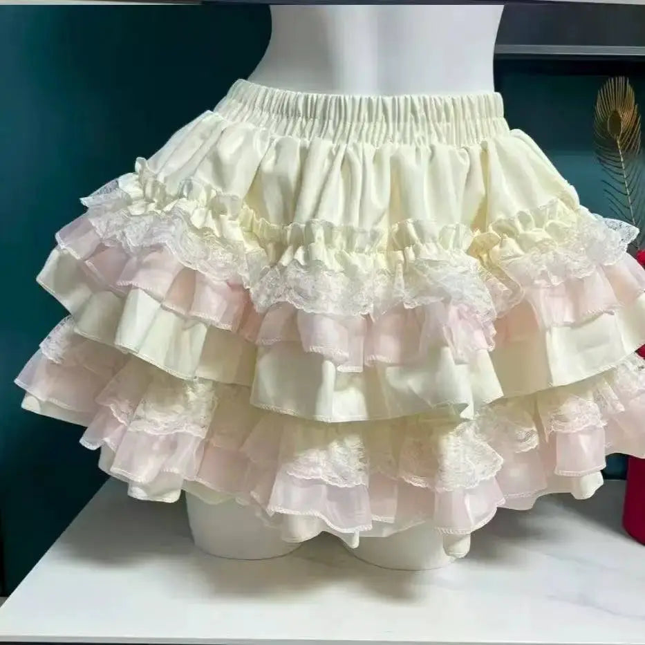 Lolita style cake skirt with ivory layered ruffles and lace trim on elastic waist