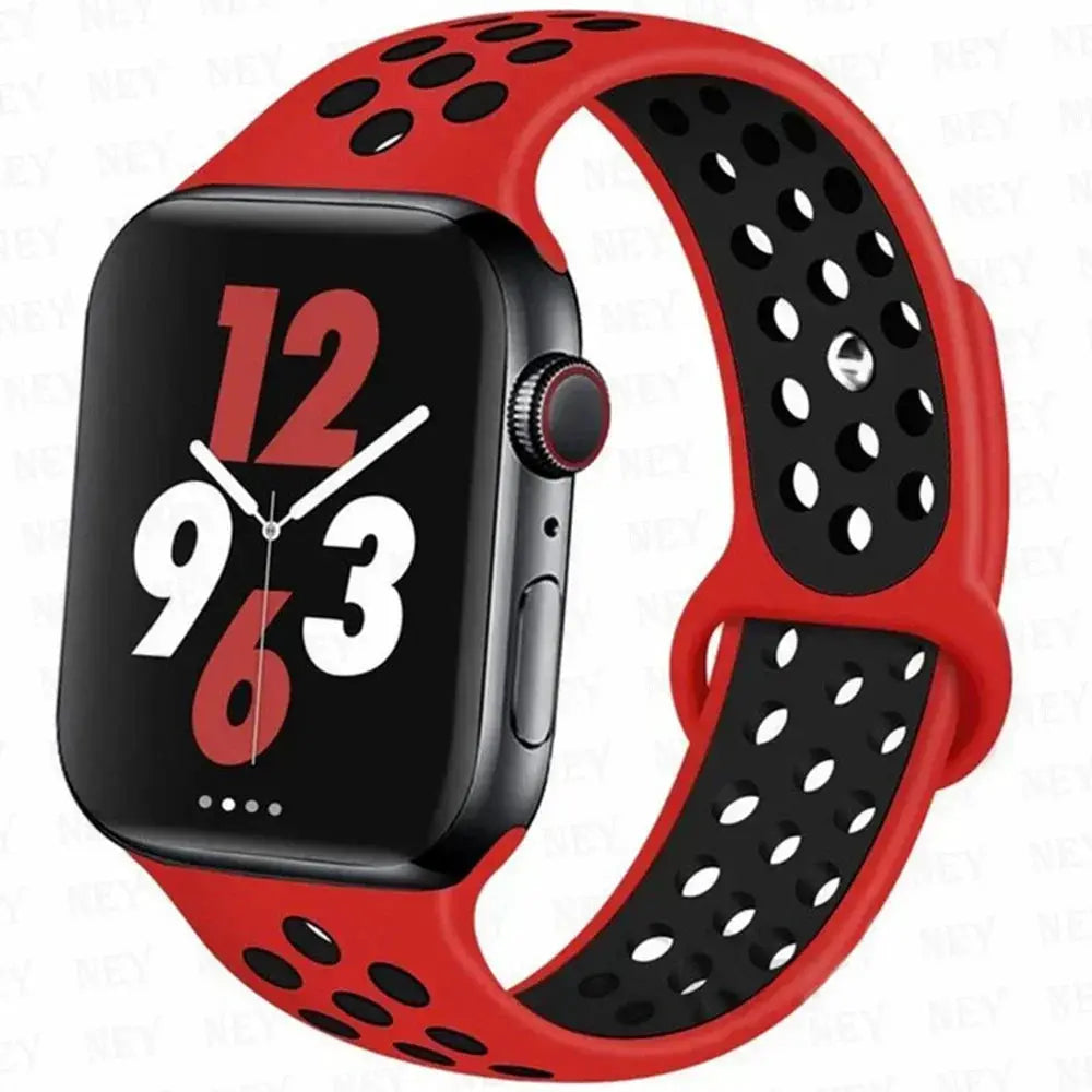 Simples Market silicone sport strap for Apple Watch; red with black perforated interior, Pride bracelet, fits 38–45mm and Ultra 49mm sizes.