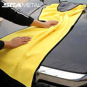 SEAMETAL microfiber car wash towel, bright yellow with black edging, shown drying a car