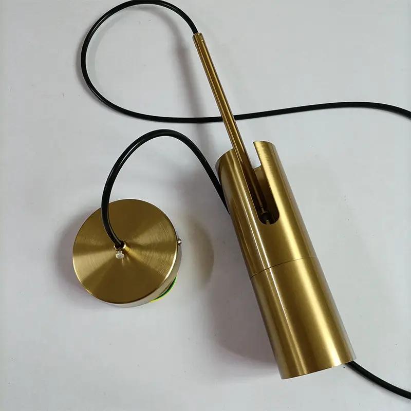 Simples Market minimalist LED hanging pendant light with brass gold finish, black cord, and round canopy