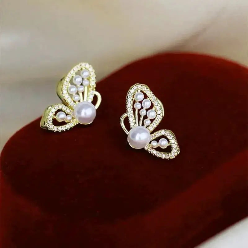 Butterfly earrings, gold-tone with white pearls and crystal accents, Simples Market pair