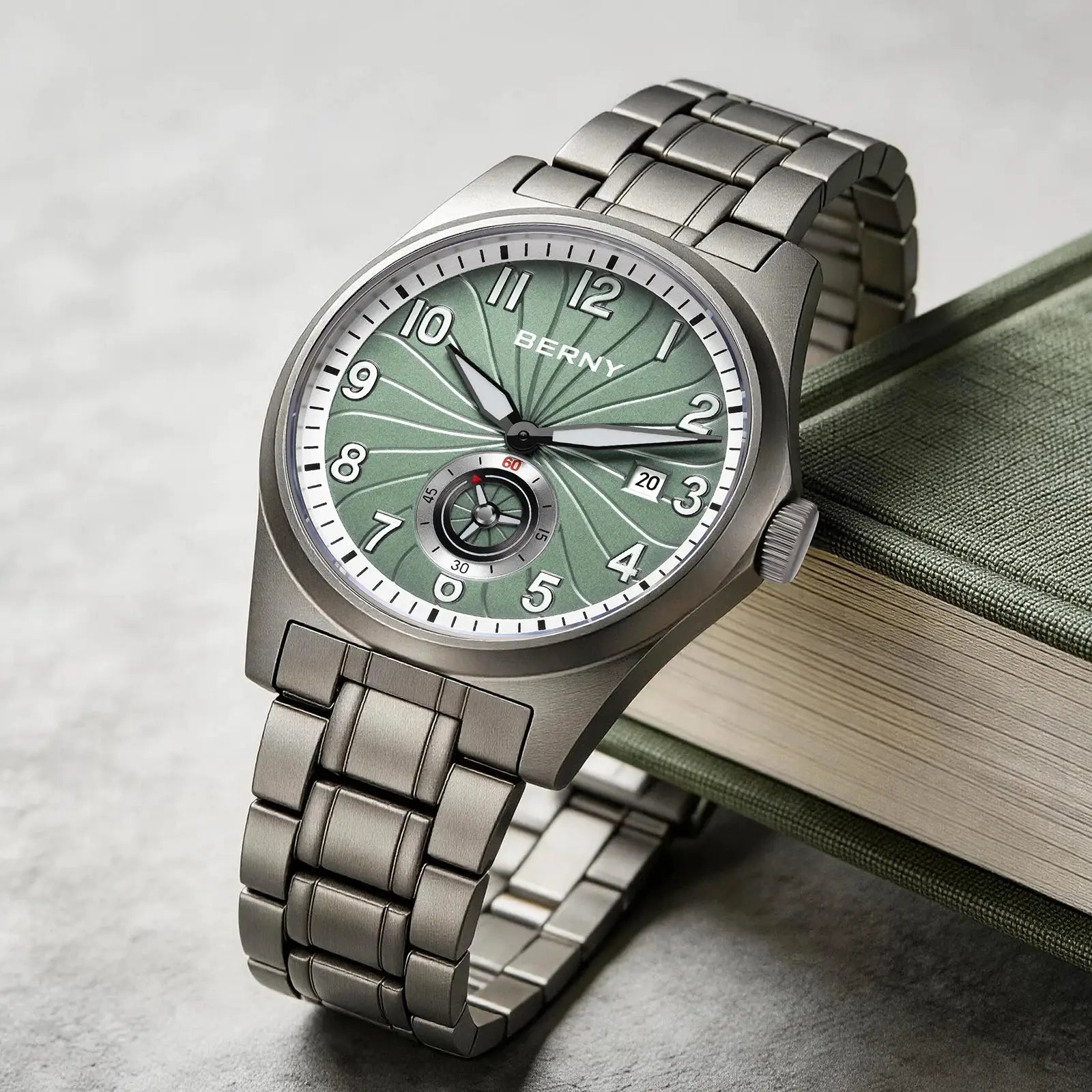 BERNY full titanium automatic men's watch with green dial and date display.