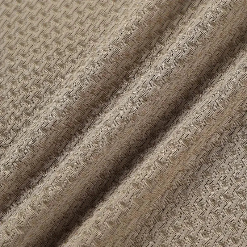 Men's polo shirt fabric close-up in bone color with breathable textured knit weave