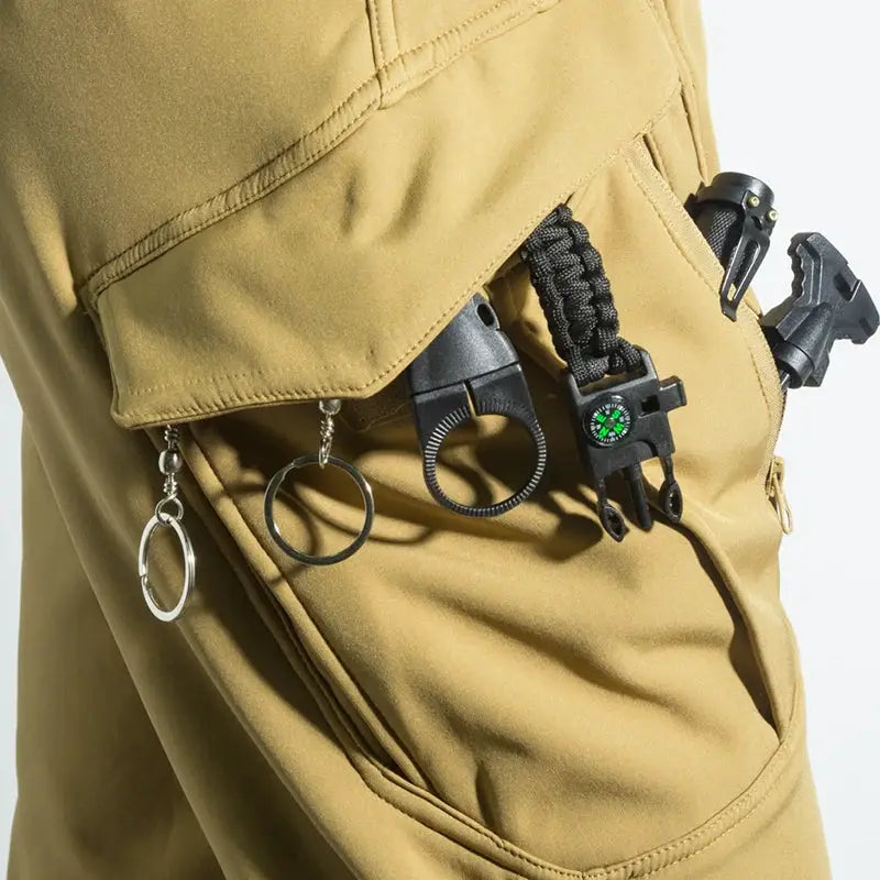 Men's tan cargo hiking pants with tool pockets and clipped gear by Simples Market