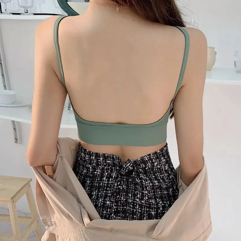 Seamless cotton padded bra in sage green, back view of a woman wearing it