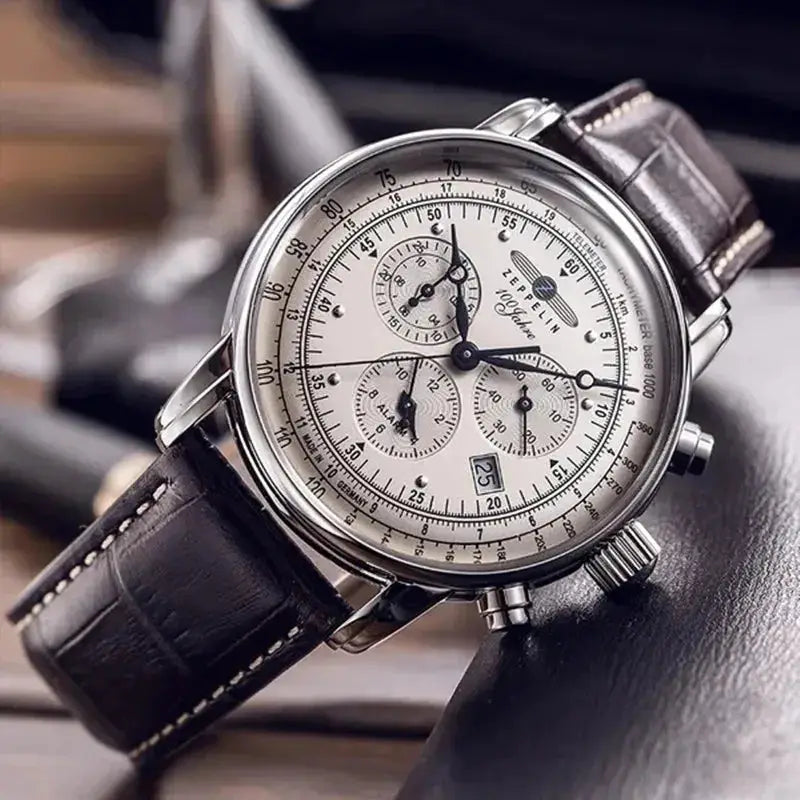Zeppelin airship commemorative men's automatic watch with silver case, brown leather strap, chronograph subdials.