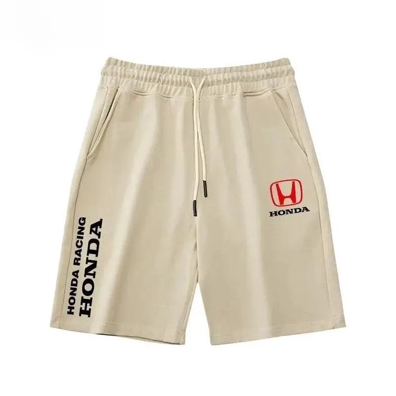 Beige Honda-branded cycling shorts with drawstring and Honda logo on the right thigh.