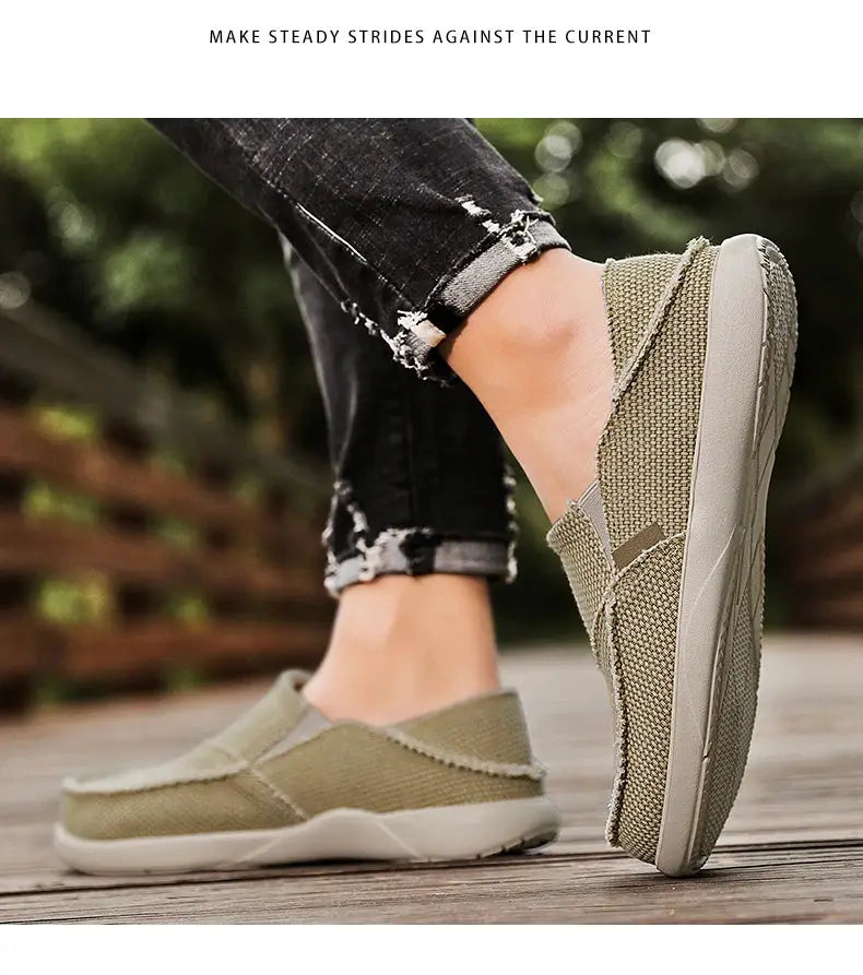 Men's olive canvas slip-on loafers, lightweight casual footwear; pair shown