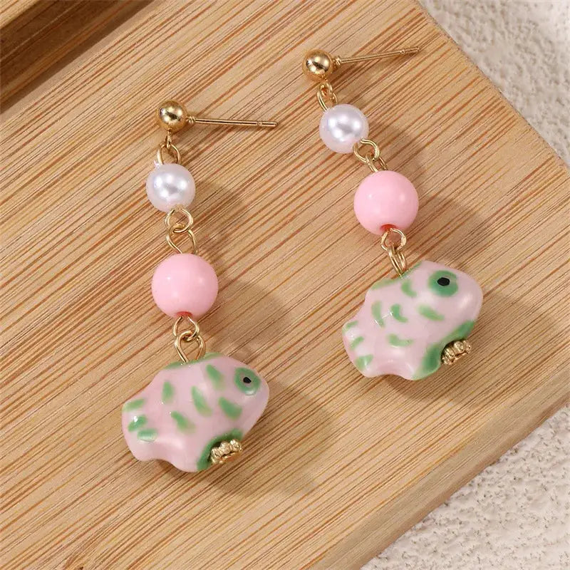 Cute octopus earrings with pastel pink beads and glass pink-green octopus charms, gold-tone drops (pair)