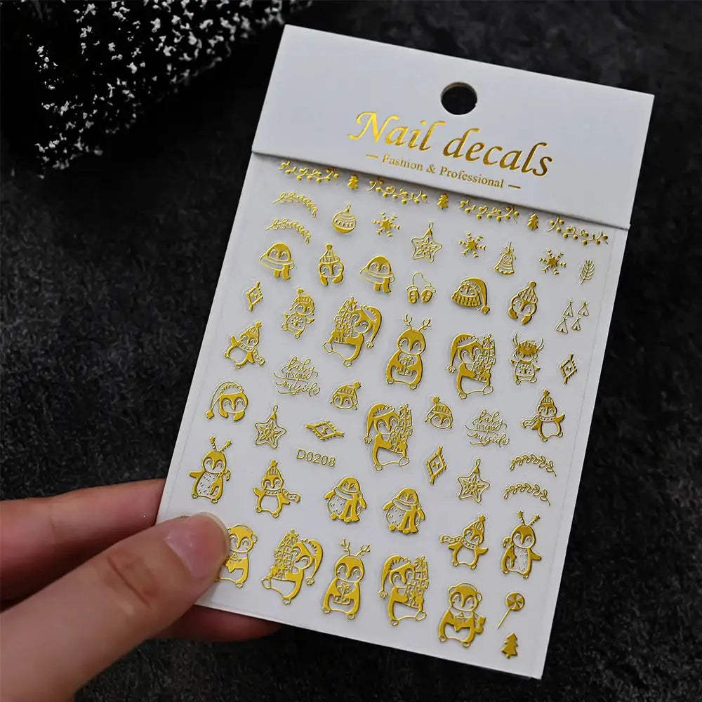 Nail decals sheet by Simples Market; gold self-adhesive winter holiday stickers.