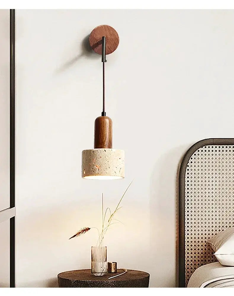 Wall lamp by Simples Market with natural stone shade and peach wood accent, bedside sconce