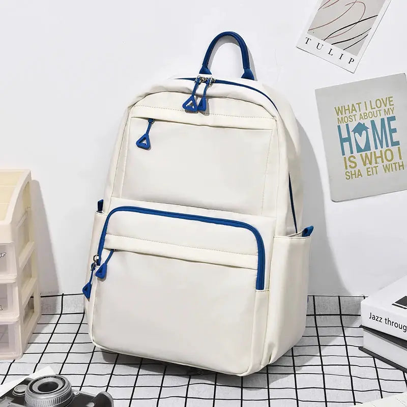 Backpack white with blue zippers, front pocket and handles, large-capacity unisex laptop school bag.