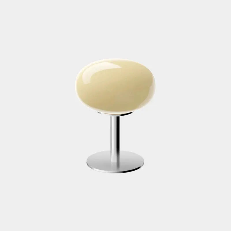 Macaron Glass Table Lamp by Simples Market with cream shade and chrome base.