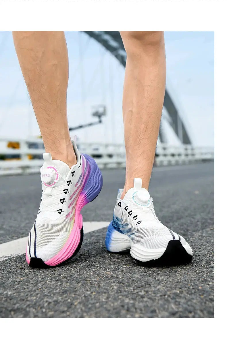Pair of white men's running shoes with pink and blue gradient soles
